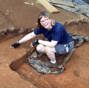 Laura Galke, DHR Chief Curator, working at an archaeological site.