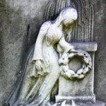 Mourning figures may also be combined with other funerary symbols, as in this tableau including a monument, wreath, and weeping willow.